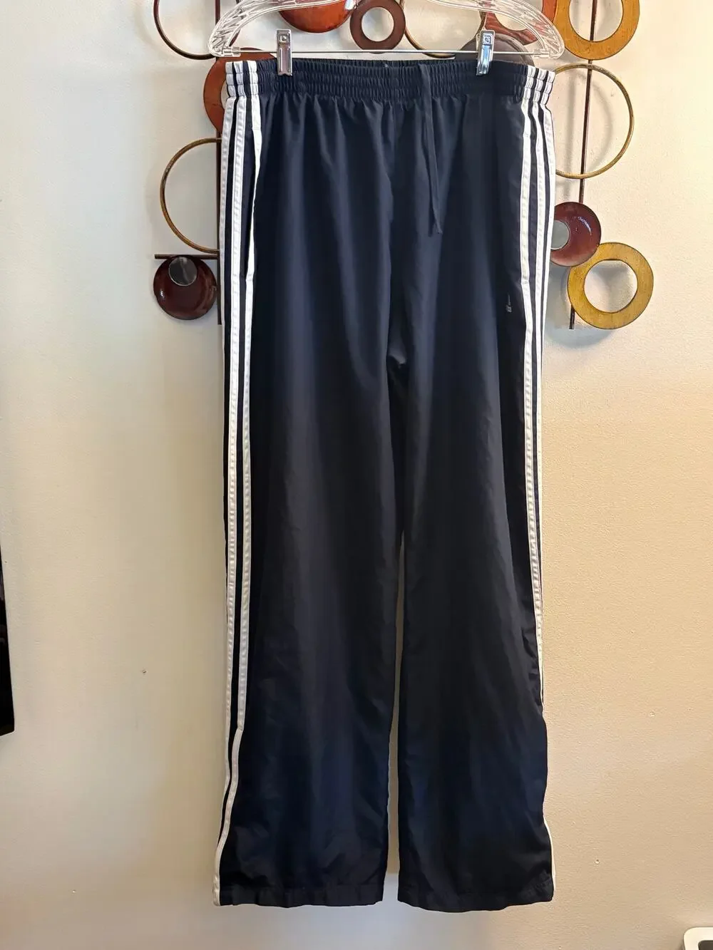 Men’s Adidas black track style pants with mesh lining